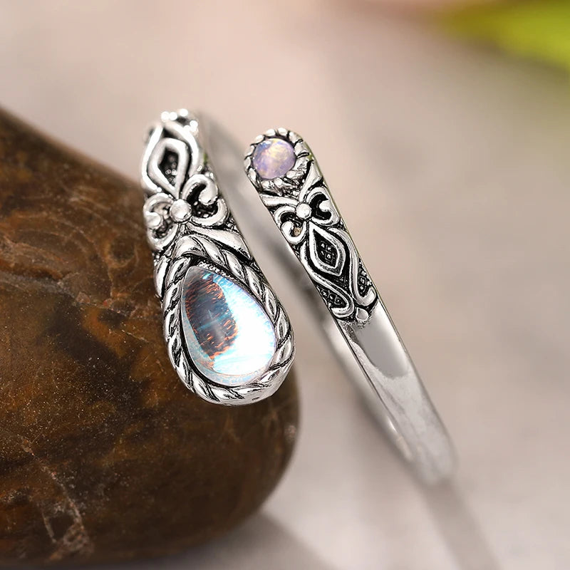 Adjustable aged-look ring with two moonstones