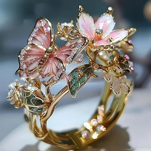 Bague ajustable fleur de cerisier et papillon or