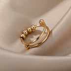 Bague Anneau Anti-Stress Perles Tournantes or