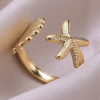 Ring mit Muscheln, Seestern und Jakobsmuschel aus Gold