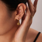 Boucles d'oreilles créoles avec pendentif soleil visage
