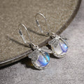 Boucles d'Oreilles Pendante Papillon et Pierre de Lune