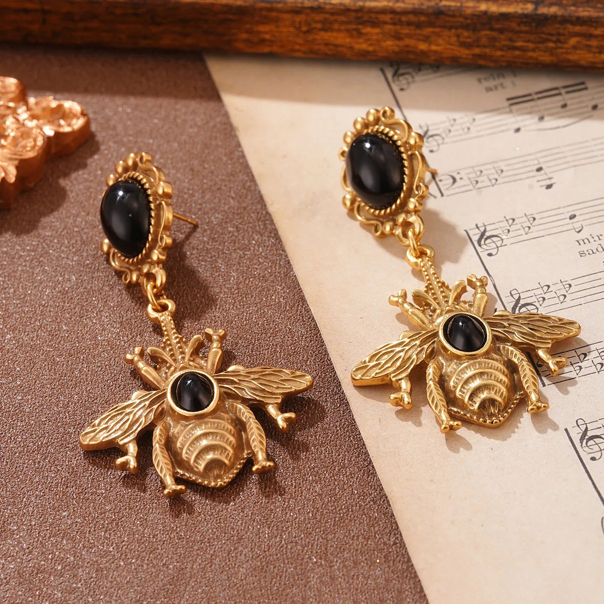 Black bee drop earrings