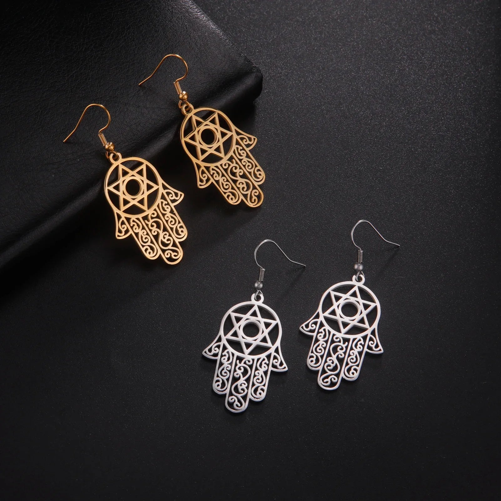 Dangling earrings with the Jewish protection symbol Fatma's hand and Star of David