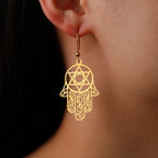Dangling earrings with the Jewish protection symbol Fatma's hand and Star of David gold