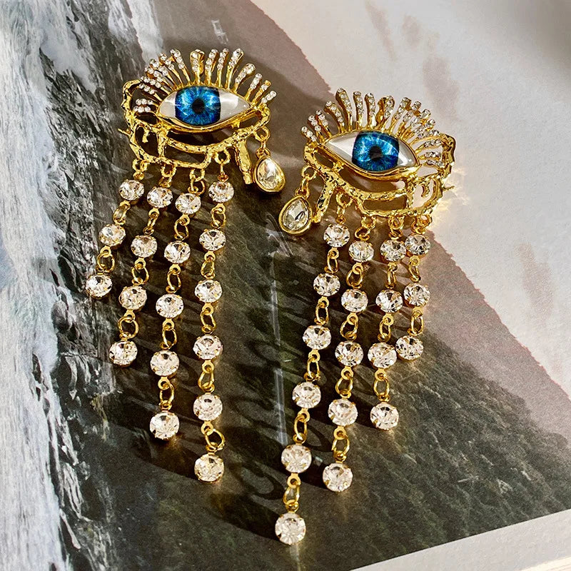 Boucles d'Oreilles Pendantes Oeil Bleu et Strass