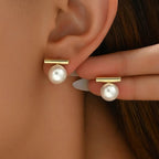 Orecchini con perla e barra geometrica