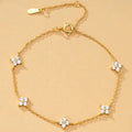 Bracciale regolabile con trifogli in strass 