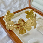 Bracelet with large hibiscus flowers, gold
