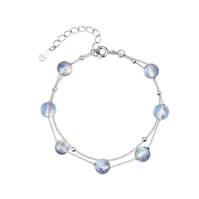 Bracelet avec perles de pierre de lune aux reflets irisés