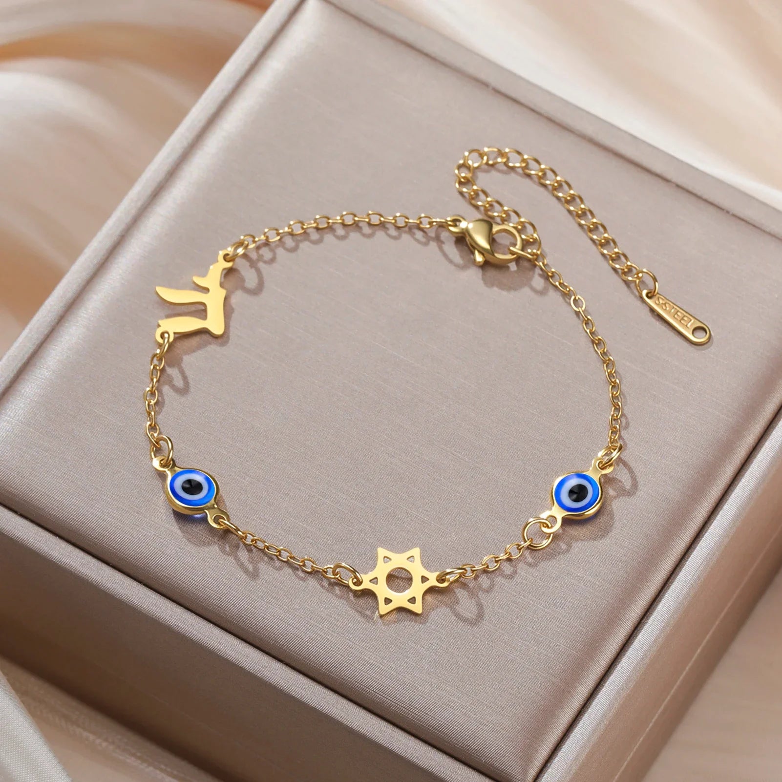 Bracelet with blue eye protection symbols, Chai and the gold Star of David
