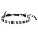 Bracciale brasiliano dell'amicizia intrecciato a mano nero e bianco