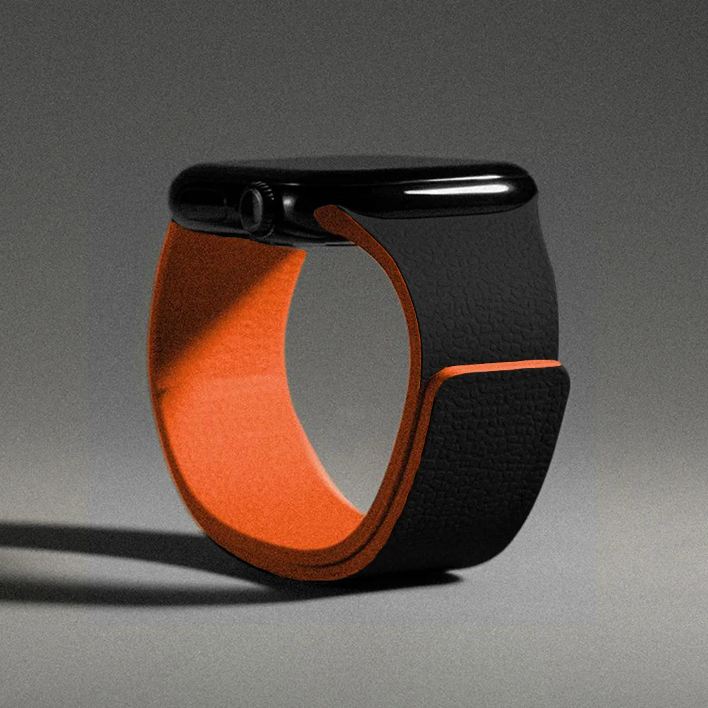 Cinturino di ricambio per Apple Watch in silicone magnetico nero e arancione
