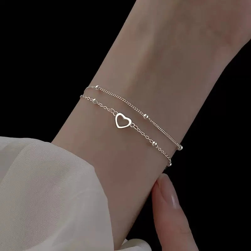 Bracelet double coeur et perles