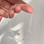 Bracelet double coeur et perles