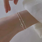 Bracelet double coeur et perles