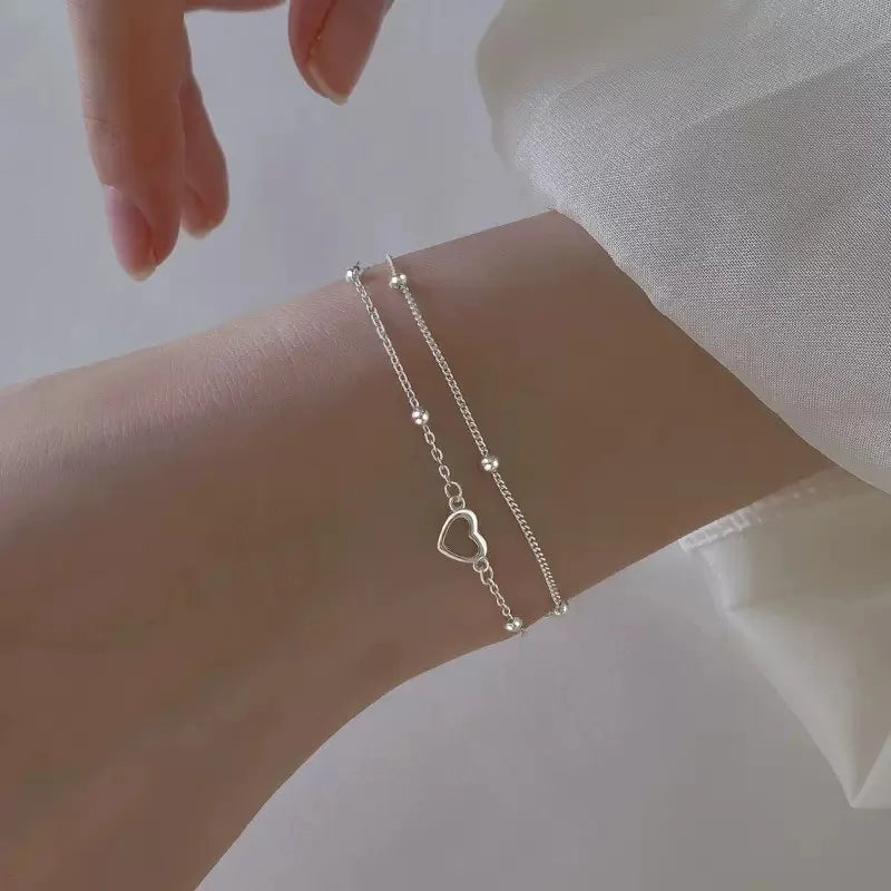 Bracelet double coeur et perles