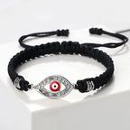 Geflochtenes Armband mit Zirkonia und türkischem Bösen Blick in Schwarz-Silber