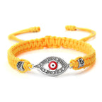 Geflochtenes Armband mit Zirkonia und türkischem Bösen Blick in Gelb-Silber