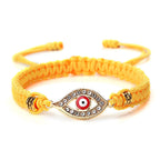 Geflochtenes Armband mit Zirkonia und türkischem Bösen Blick in Gelbgold
