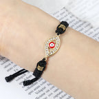 Geflochtenes Armband mit Zirkonia und türkischem Bösen Blick in Schwarz-Silber