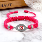 Geflochtenes Armband mit Zirkonia und türkischem Bösen Blick in Rosé-Silber