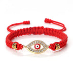 Geflochtenes Armband mit Zirkonia und türkischem Bösen Blick in Rotgold