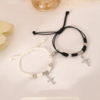 Schwarz-weiße Partnerarmbänder mit Kreuz-Gourmette