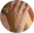 Chaîne pour main et doigt avec zircons - bracelet de main pour femme or