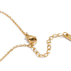 Collier avec grand pendentif demi-soleil aux rayons ondulés