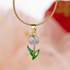 Necklace with white and purple colored enamel tulip flower pendant