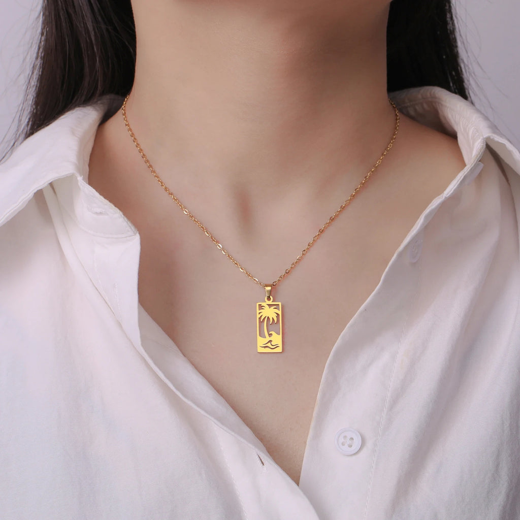 Collier avec pendentif palmier et vague de plage or