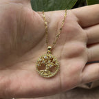 Necklace with round tree of life pendant paved with crystals