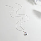 Ketting met hanger van een orka en golven in maansteen