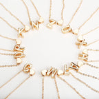 Women's necklace with initial and heart pendant