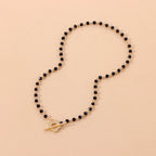 Halskette Choker Anhänger Blume schwarz und silber