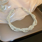 Collier torsadé avec pendentif perle