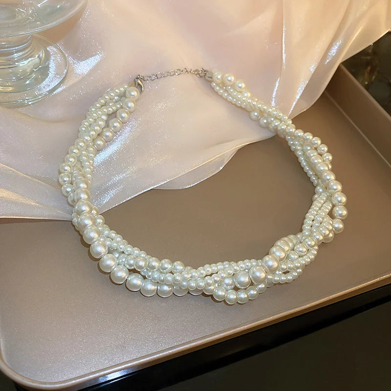 Collier torsadé avec pendentif perle