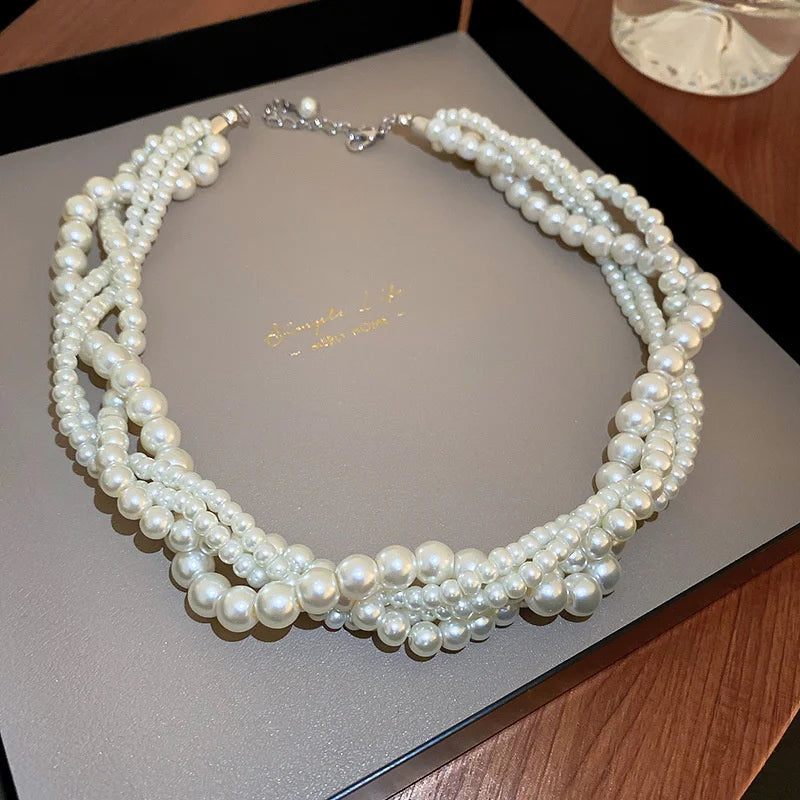 Collier torsadé avec pendentif perle
