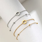 Pulsera de doble inicial oro y plata  o