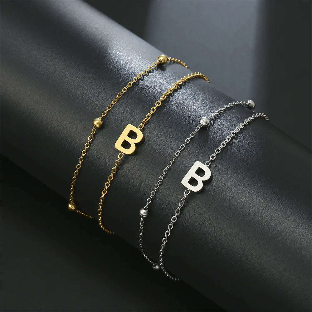 Pulsera de doble inicial oro y plata  b