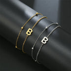 Pulsera de doble inicial oro y plata  b