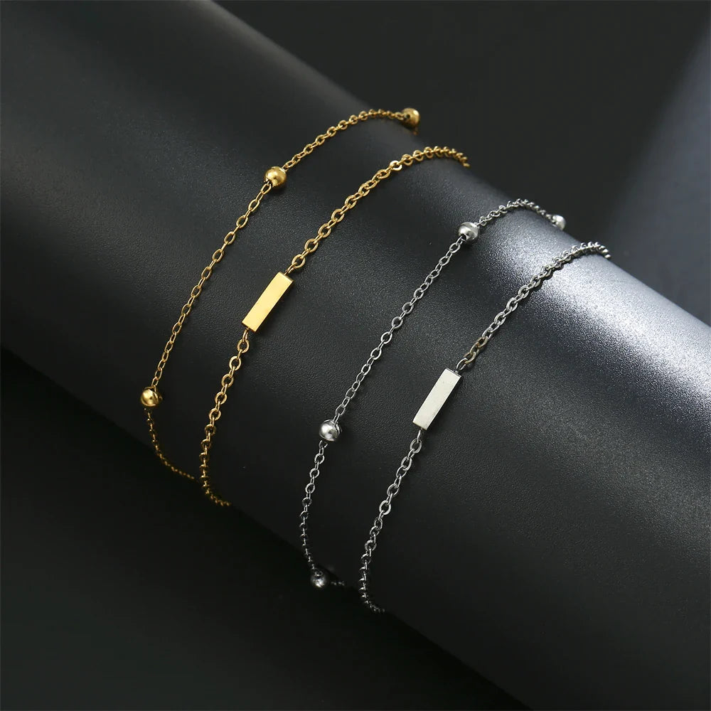 Pulsera de doble inicial oro y plata  i