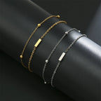 Pulsera de doble inicial oro y plata  i