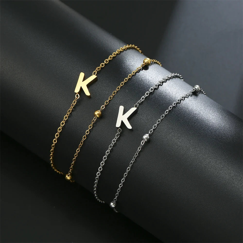 Pulsera de doble inicial oro y plata k