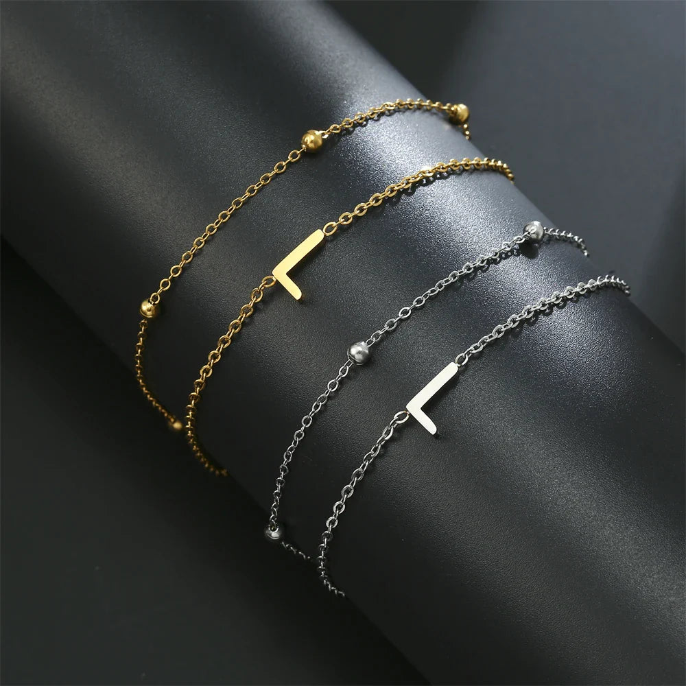 Pulsera de doble inicial oro y plata  l