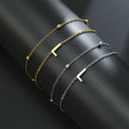 Pulsera de doble inicial oro y plata  l