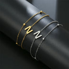 Pulsera de doble inicial oro y plata  n