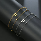 Pulsera de doble inicial oro y plata  p