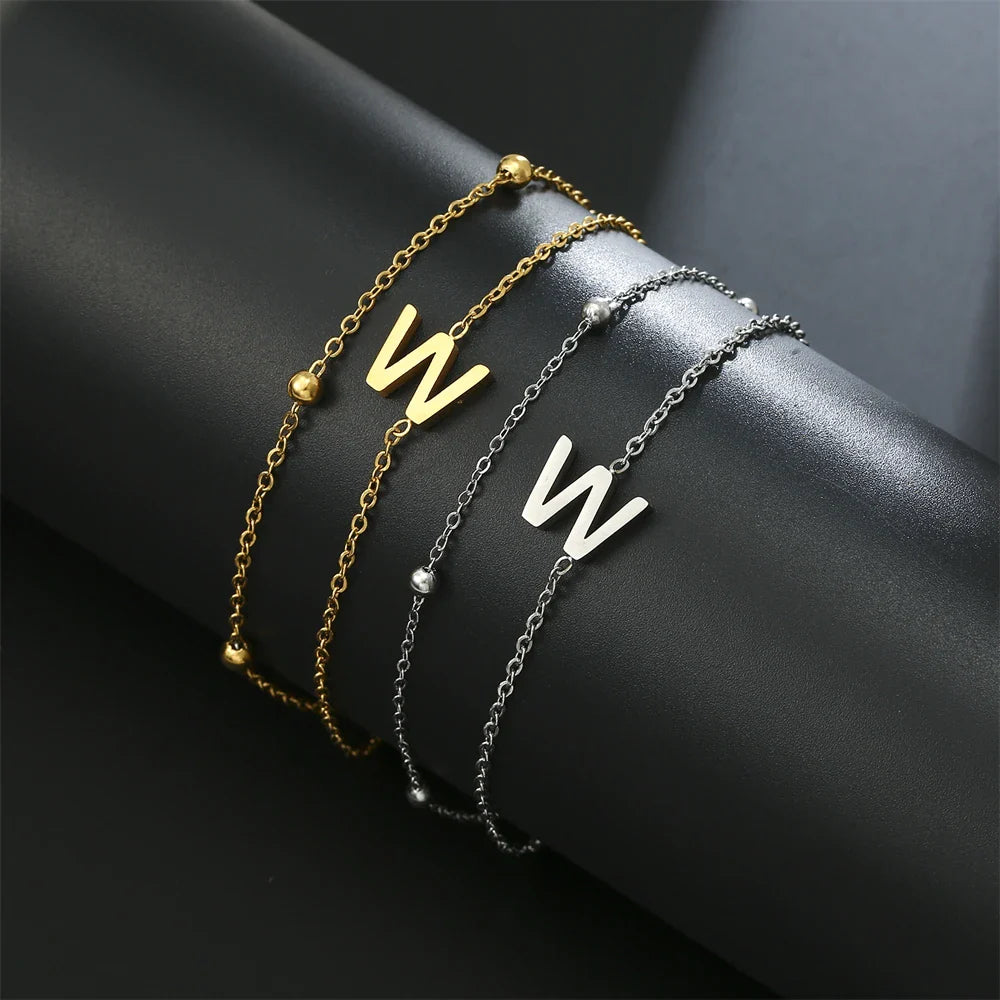 Pulsera de doble inicial oro y plata  w